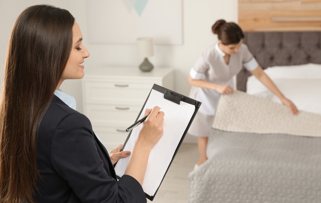 Housekeeping Manager Checking Maid Work in Hotel Room